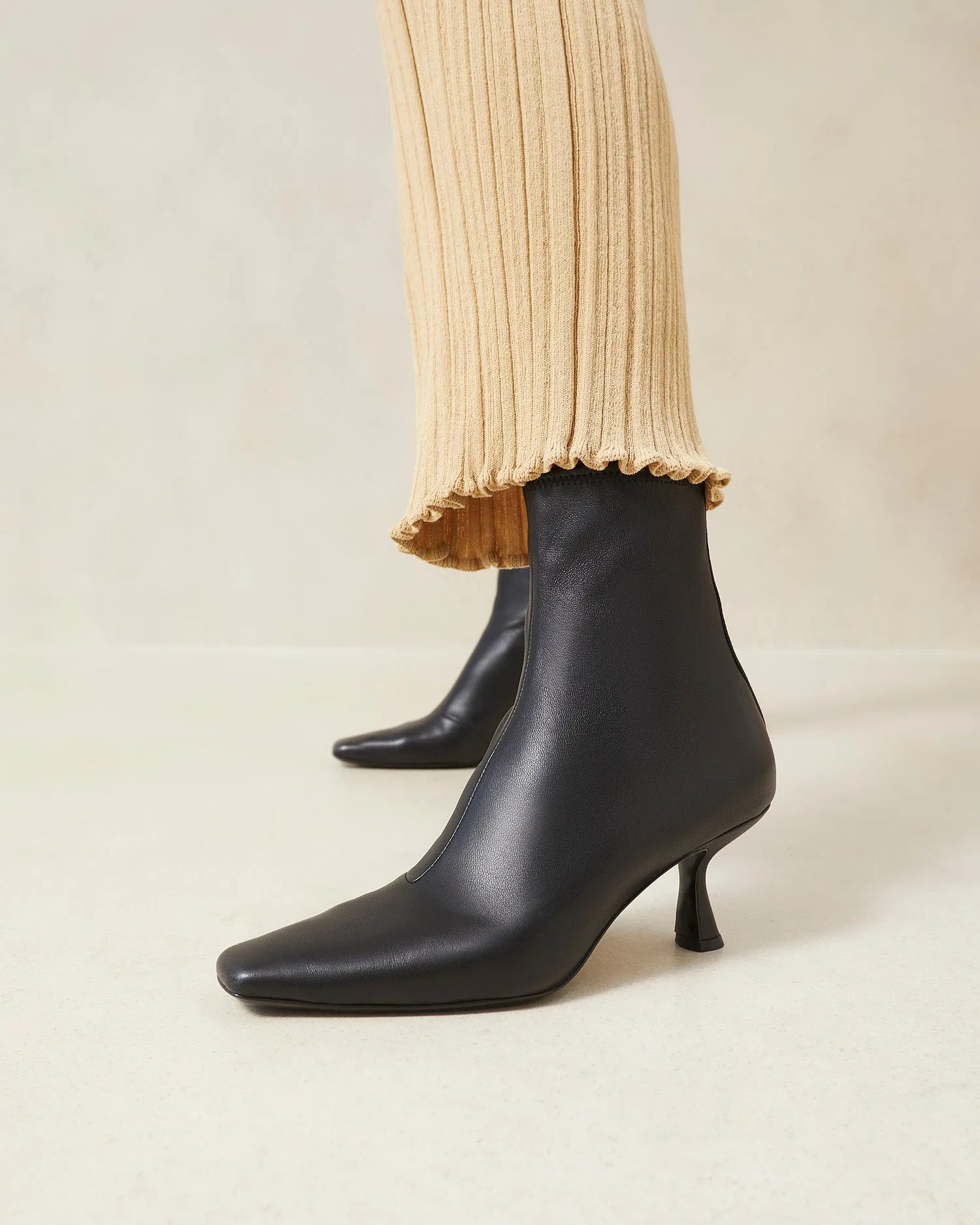 Thandy Black Curved Heel Bootie