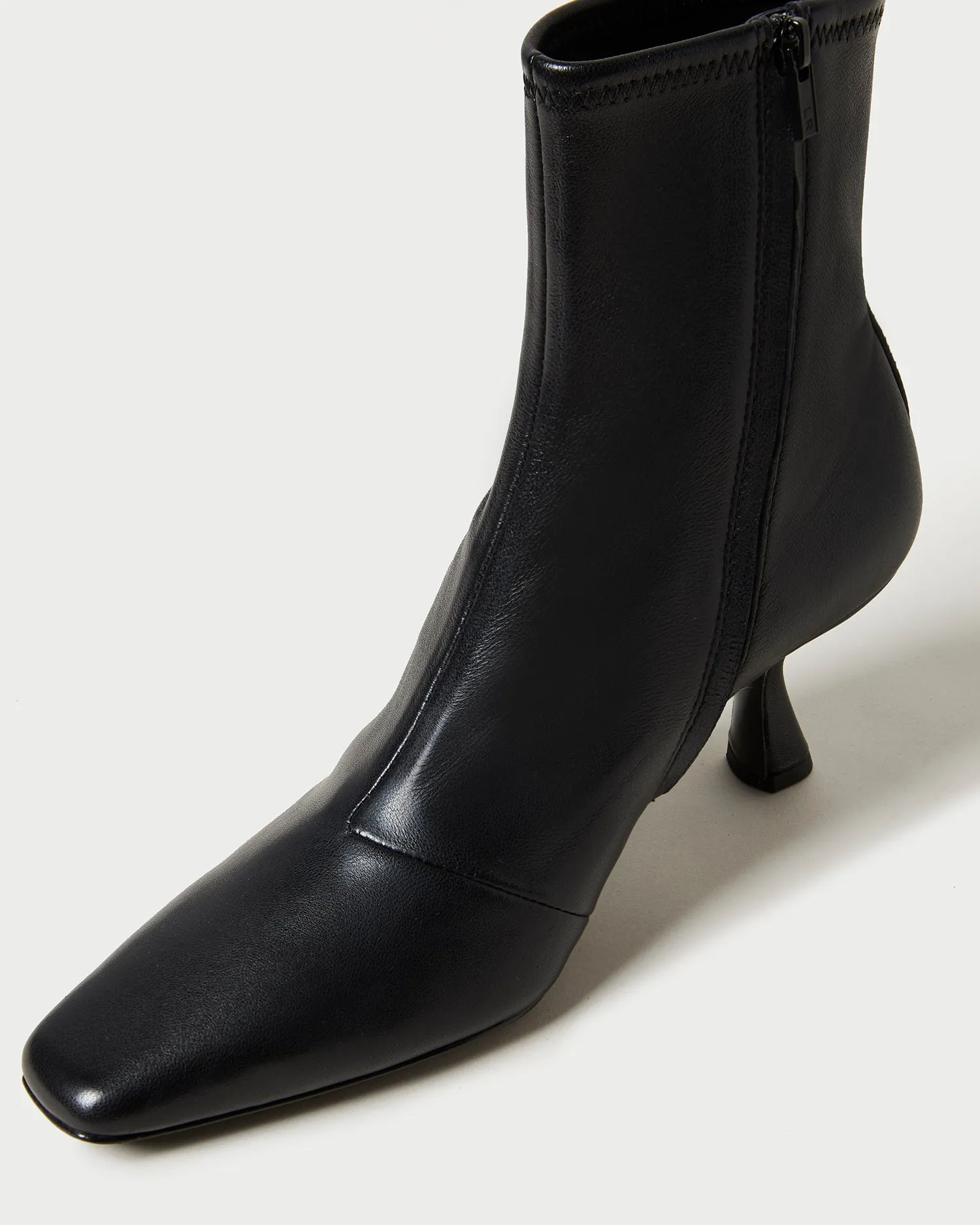 Thandy Black Curved Heel Bootie