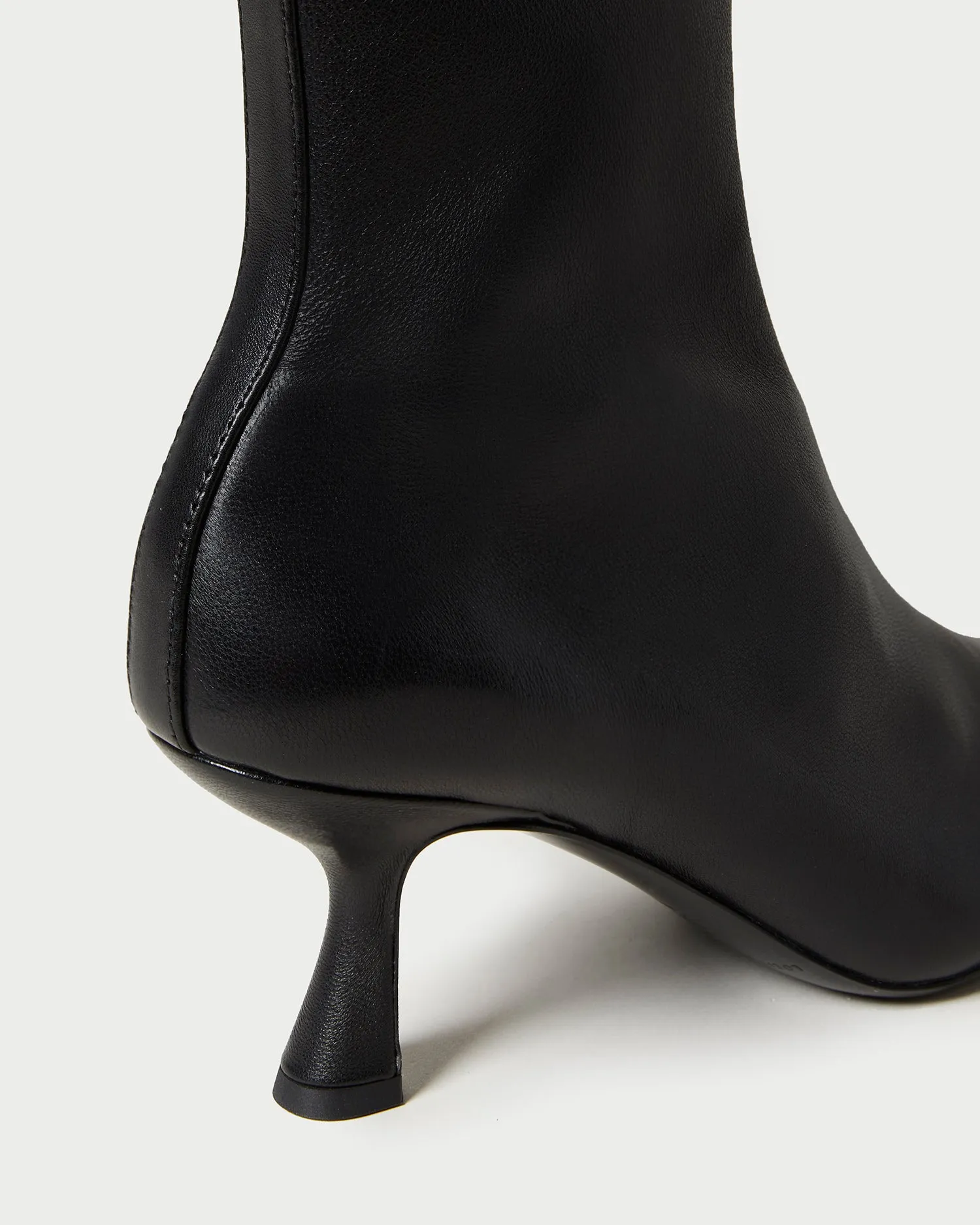 Thandy Black Curved Heel Bootie